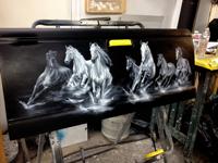 Horses airbrushed onto a pickup truck's tailgate.  Before Clear coating