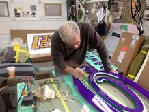 Gary hand painting the final details. of the sign in the town of Babylon, NY