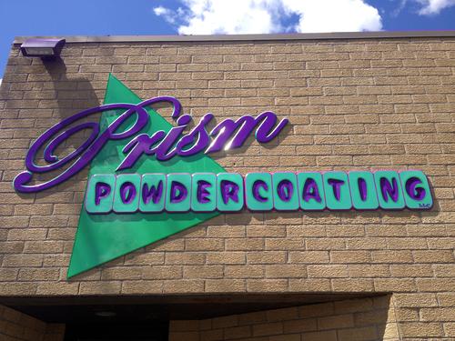 A uniquely different dimensional & carved PVC & aluminum sign seen on the brick wall in Babylon, NY