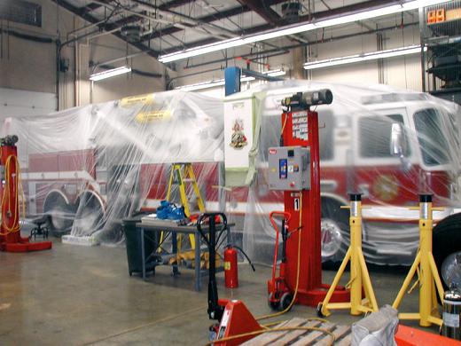 The North Bellmore fire truck is completely covered in plastic to protect the entire truck while painting the the Bulldog logo